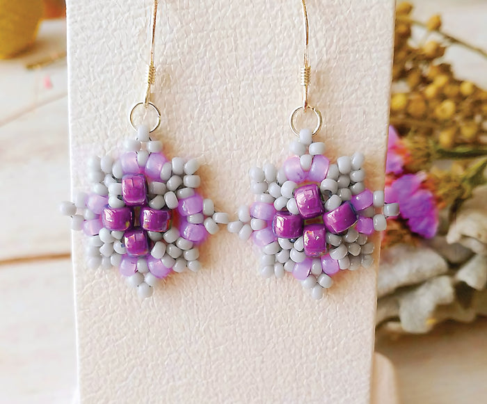 Close-up of small, handcrafted earrings made with purple beads - Bless4Happy Earrings